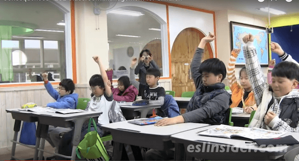 korean students raising their hands